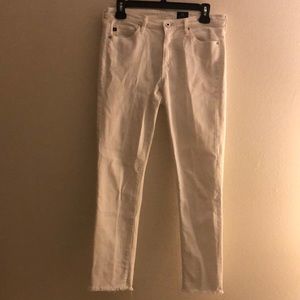 AG white size 27R skinny jeans. Jagged bottom , Waist 16 in inseam 27in